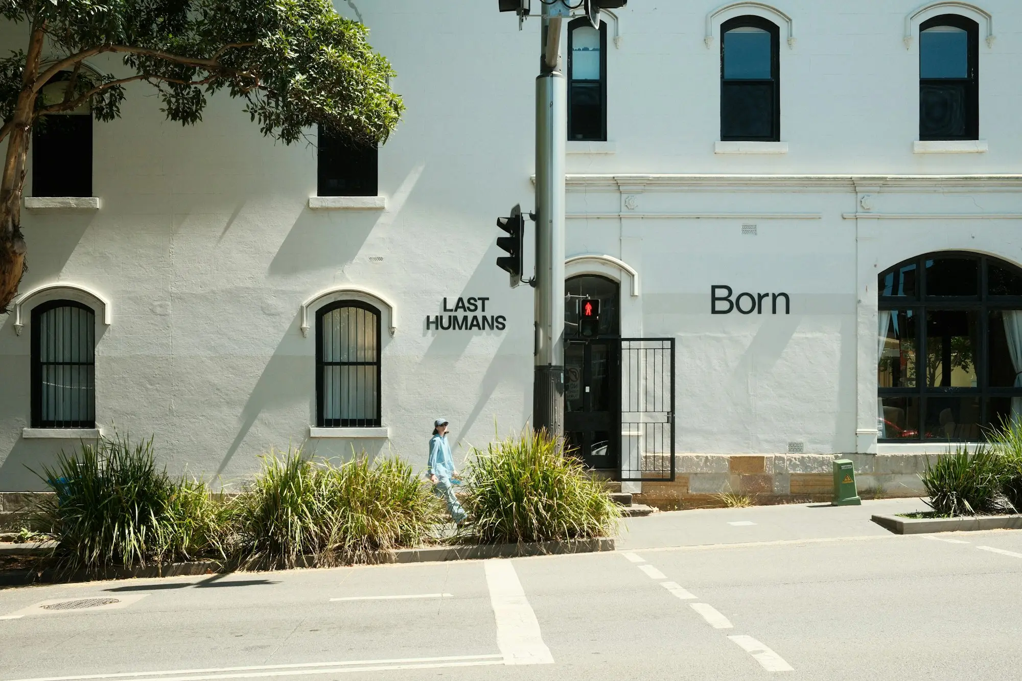 Person walking past heritage shopfronts